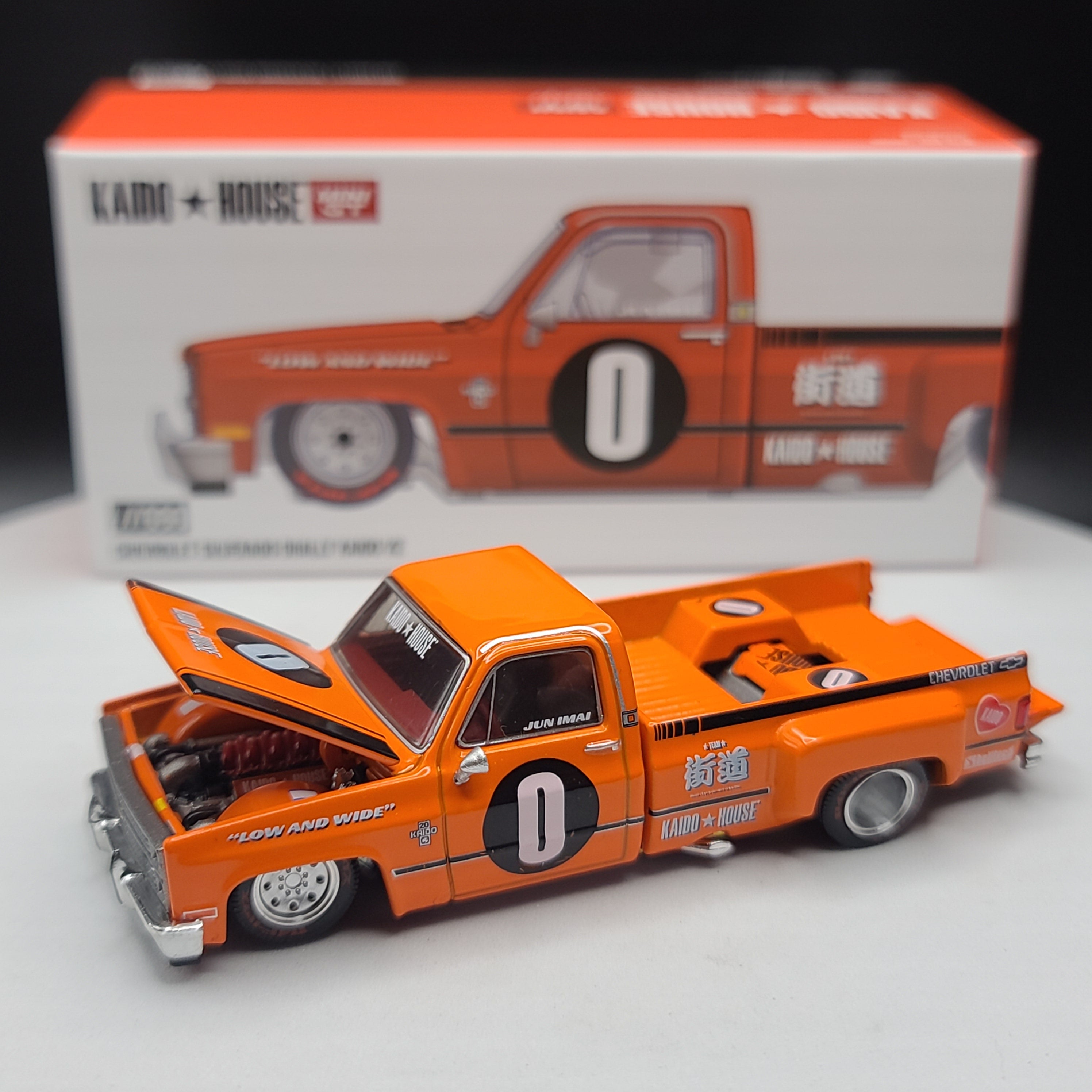 Kaido House x Mini GT '83 Chevrolet Silverado Dually Kaido V2 - 1:64, Orange (2024 Limited Edition)