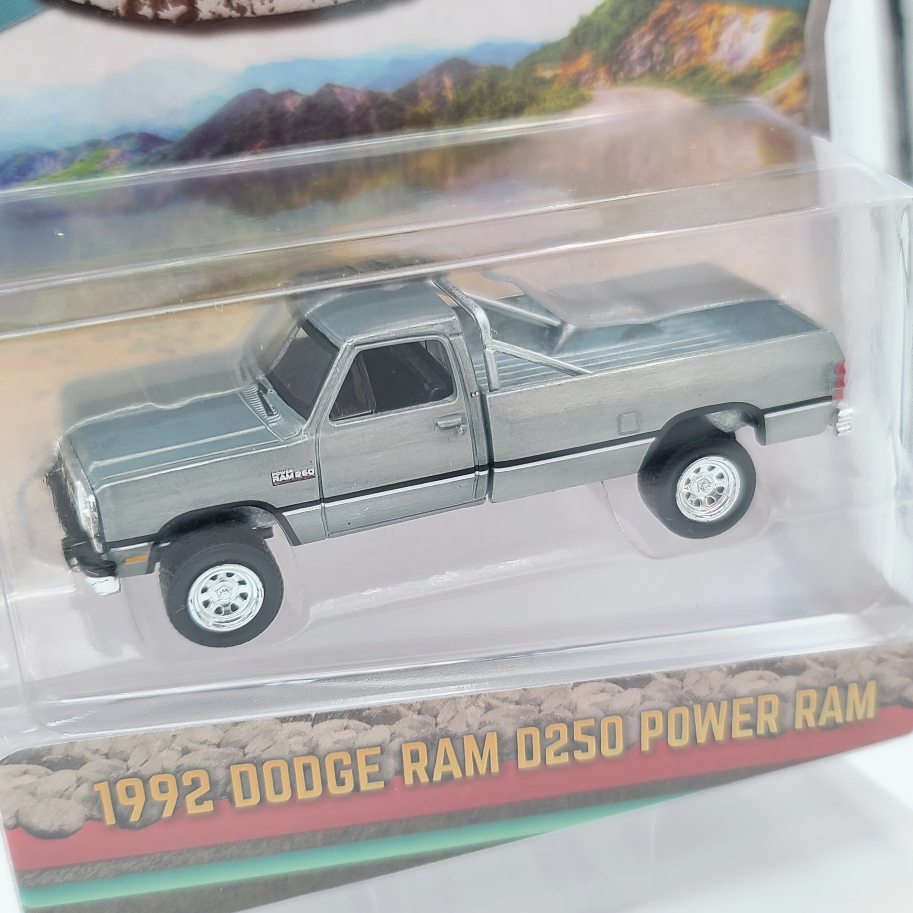 GreenLight - CHASE, Raw Metal - '92 Dodge Ram D250 Power Ram Lifted w/ Rollbar - 1:64 scale (2024 All Terrain Series 16)